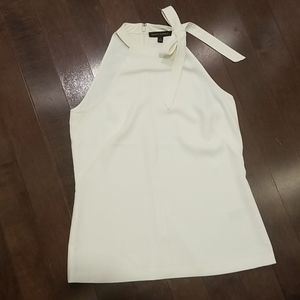 Sleeveless halter style blouse with bow detail